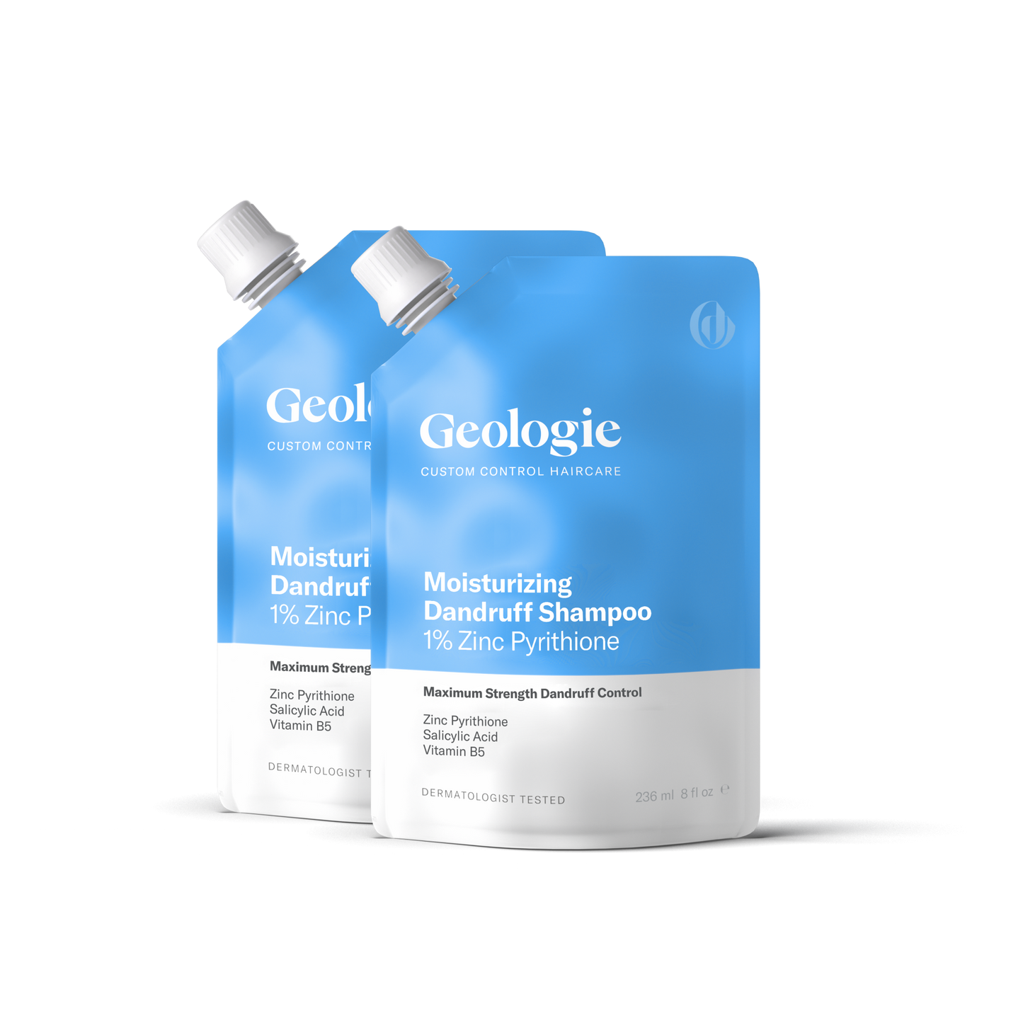 Two bottles of Geologie Moisturizing Dandruff Shampoo with 1% zinc pyrithione against a dark background, effective for treating dandruff.